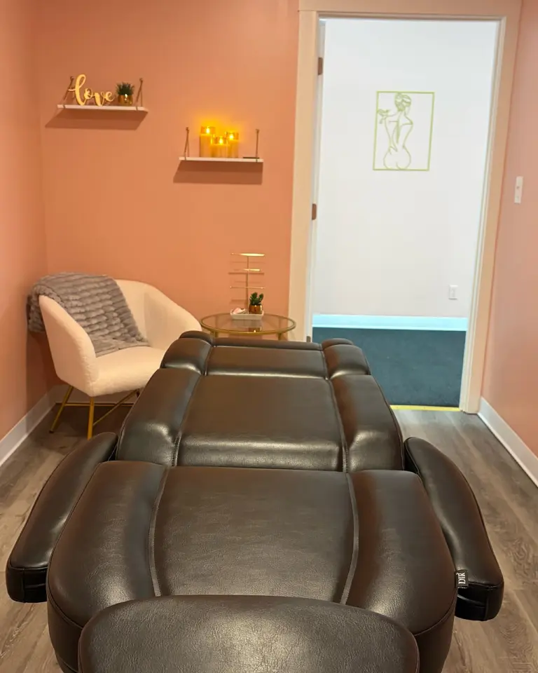 A Spathetics treatment room with the treatment chair and an armchair